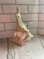Front view of the Royal Doulton porcelain figurine showing the woman and dog in calm walking pose