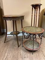 Group photo showing three distinct side tables with wooden and woven surfaces, including a tall plant stand, a wrought iron framed table with wicker surfaces, and a wooden woven rattan table.