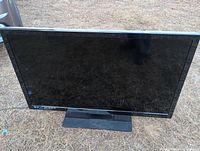 Front view of Westinghouse 50 inch LCD TV on stand, screen off.