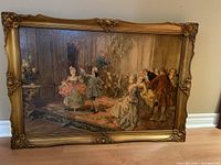 Full view of painting and frame leaning against wall