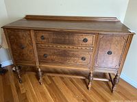 Front view of buffet cabinet showing overall design and condition