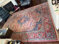 Full view of rectangular rug in living space showing overall pattern and size