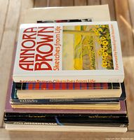 Stack of 11 art books with visible cover of 'Annora Brown Sketches from Life' showing a colorful landscape painting.