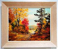 Full front view of the framed oil painting showing fall landscape with colorful trees and winding road.