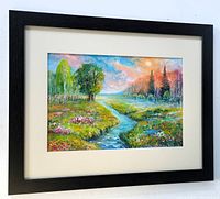 Framed landscape painting showing river, trees, flowers, and colorful sky. Black wood frame with cream matting and plexiglass.