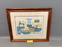 Framed lithograph showing an attic room with toys including a rocking horse, rocking chair, small dog toy, and furniture.
