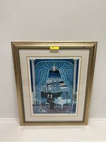 Photo showing the full framed lithograph artwork with gold frame and blue curtain design