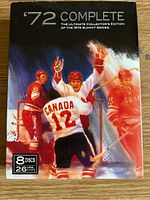 Slipcase cover with artwork featuring hockey players from the 1972 Summit Series, with text indicating 8 discs and 26 hours of hockey.