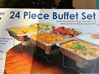 Box photo showing 24 Piece Buffet Set contents with disposable aluminum pans, plastic lids, and wire racks.