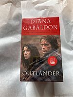 Boxed set front showing Diana Gabaldon author name and image from the show, indicating mint and sealed packaging.