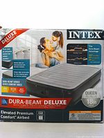 Front of the INTEX air mattress box showing the product image, brand, key features, and queen size specification.
