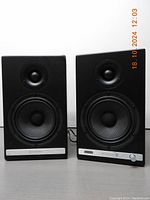 Pair of Audioengine HD6 speakers front view showing cabinet finish and controls.