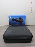 Boxed RENPHO Power+ massage gun and closed hard carrying case