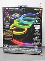 Box of Monster Smart IlluminEssence RGB+IC Smart Rope Light showing product features such as 16.4ft length, 300 multicolor RGB+IC LEDs, app control, voice assistant compatibility, and dimmable settings.