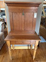 Full frontal view of desk in closed position showing overall form