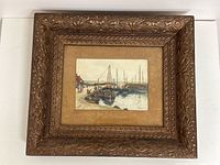 Framed watercolour painting showing the entire piece including the carved wood frame and matting.