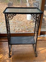 Front left view showing overall structure, scrollwork and claw feet