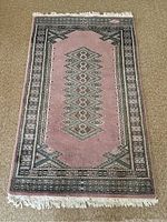 Full view of the Persian rug laid flat showing the overall pattern and color scheme.