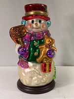 Front full view of the large snowman figurine showing colorful details and full height.