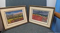 Pair of framed impressionist landscape paintings on board showing vibrant colors with frames and linen matting, displayed together.