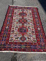 Full view of entire rectangular rug laid flat outdoors