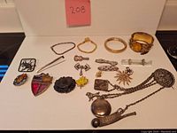 Overview of entire lot on white background with pink lot number card visible