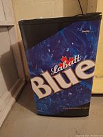 Front angled view of the Danby mini fridge with distinctive blue Labatt Blue branding and logo.