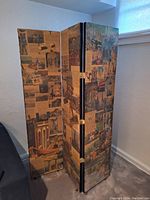 Three-panel folding room screen showing travel photo collage decoupage, viewed angled to show all panels and hinges