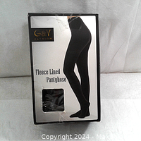 Black fleece lined pantyhose in G&Y Fashion packaging showing product label and silhouette.