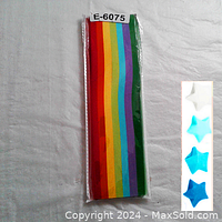 Front view of a sealed package of multi-colored paper strips arranged in a rainbow order for origami stars.