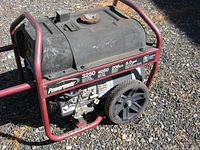 Full view of Powermate SX Series generator showing frame, large wheels, fuel tank, and engine compartment.