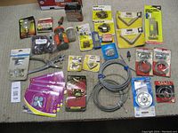 Top-down photo showing entire hardware lot assortment on carpeted surface