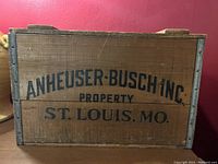 Closed wooden Budweiser beer crate with Anheuser-Busch Inc. labeling on side