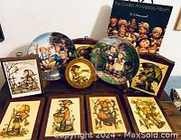 Group photo showing seven musical pull string plaques, two decorative plates, and the Golden Anniversary Album in slipcase