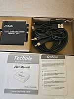 Techole HS203-BK audio converter with cables, user manual, and product leaflet arranged inside box.