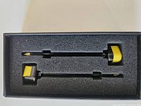 Two SpeedyBee FPV antennas in black foam packaging with yellow SMA right-angle connectors and gold MMCX connectors, showing full set.