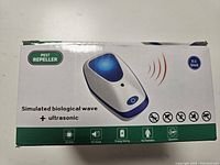 Box for ultrasonic pest repeller showing product image and features including simulated biological wave and ultrasonic technology. Multipack of 4 units.