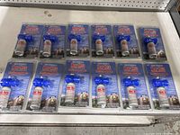 Twelve Frontiersman Bear Horn air horns in original blister packaging displayed on a shelf.
