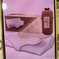 Box packaging showing Sliffi Memory Foam Pillow with ergonomic design and carrying pouch