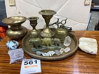 Full display of brass items, crystals, and minerals on brass tray