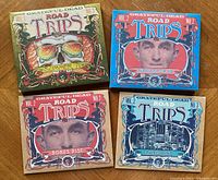 Four Grateful Dead Road Trips CDs with original cardboard fold-out cases featuring colorful graphic art including skull and band member images.