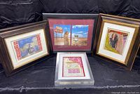 Four pieces of framed mixed media art by Stephen Millner, displayed on black cloth background