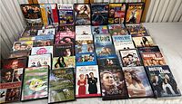 Overview of entire DVD collection showing multiple genres including action, comedy, television, horror, thriller, musical DVDs.
