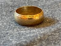 Front profile of ring showing band shape and hammered-edge detail