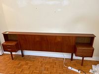 Front view of teak headboard with side tables