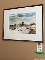 Full front view of framed watercolour painting mounted on wall with lot sticker visible