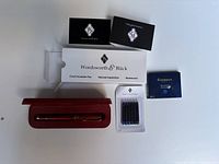 Photo showing Wordsworth & Black box with informational inserts and ink cartridges.