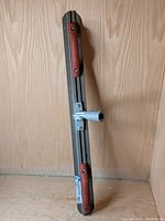 Front view of the magnesium Derby T-Float showing red handles and central attachment point.