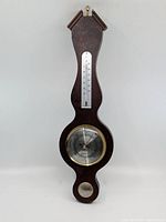 Full view of antique wooden barometer with thermometer and hygrometer, showing overall condition and dimensions.