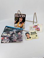 All items in the lot displayed together including stamps on envelope, license card, postcards, and horoscope card